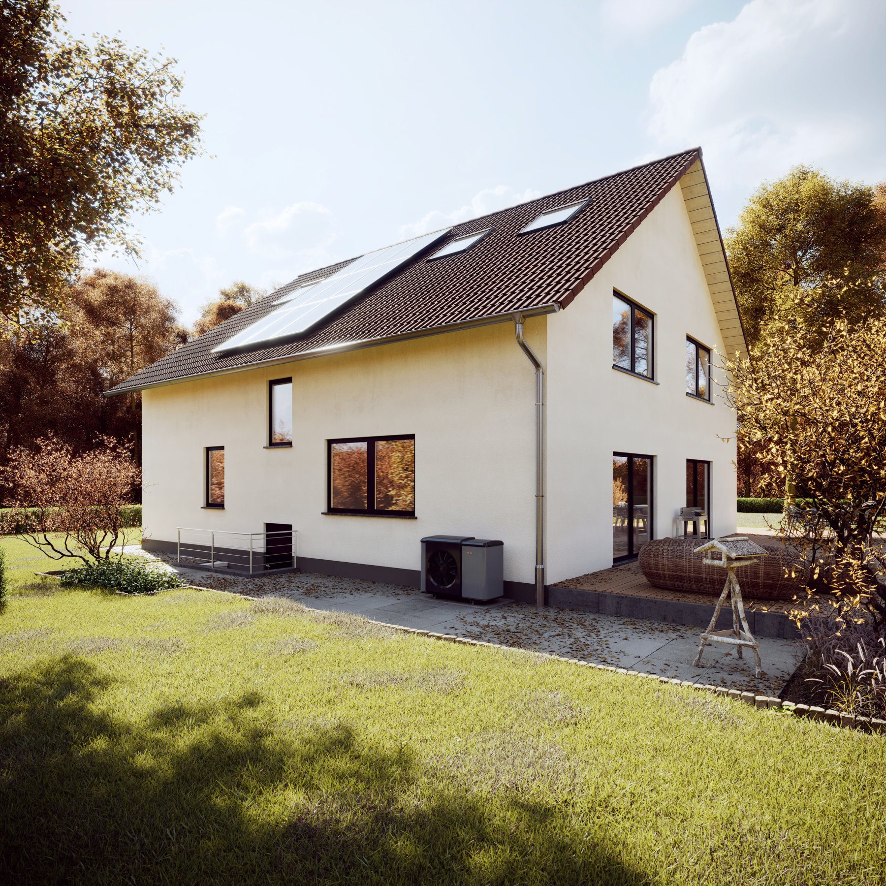 Großes Familienhaus mit Terasse und Garten bei herbstlichem Wetter